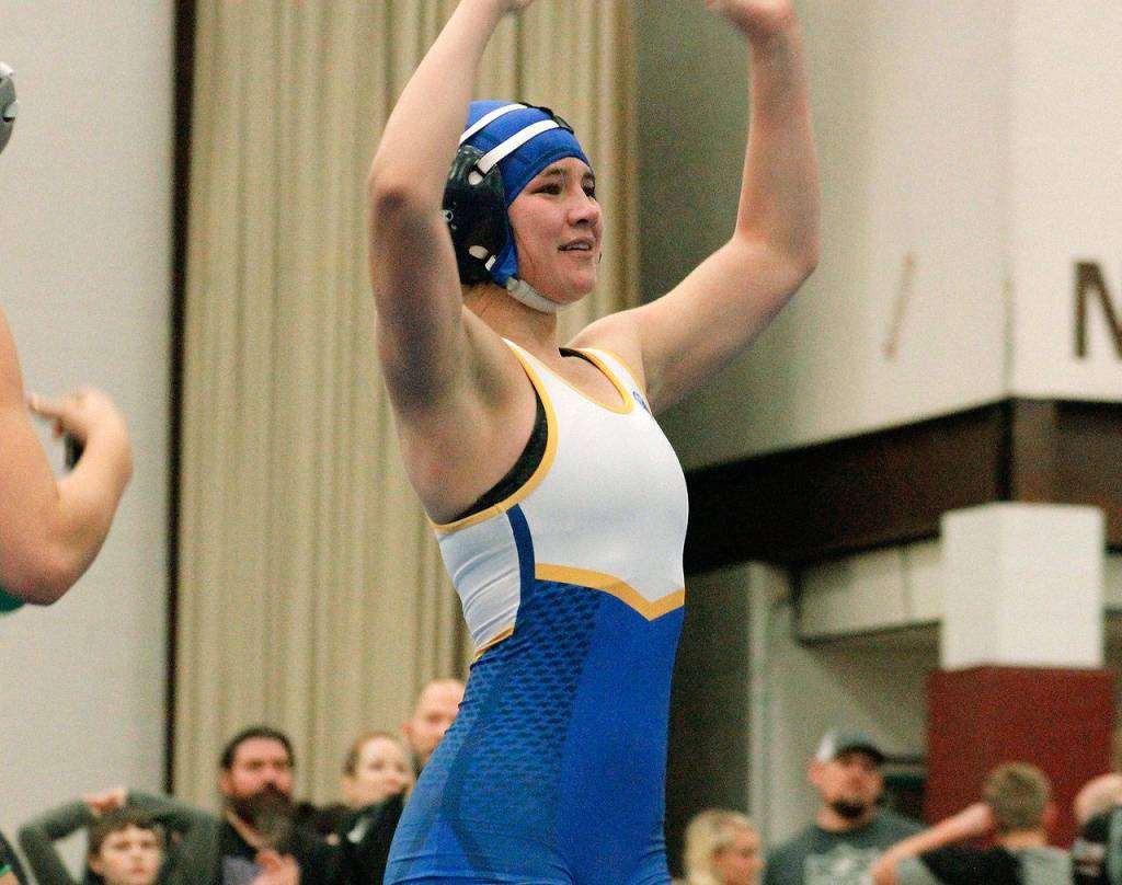 Bremertons Haley Michaelson celebrates an emotional victory in the 140 finals. She pinned Ivy Kraght of Kentwood in just 1:34. (Mark Krulish/Kitsap News Group)