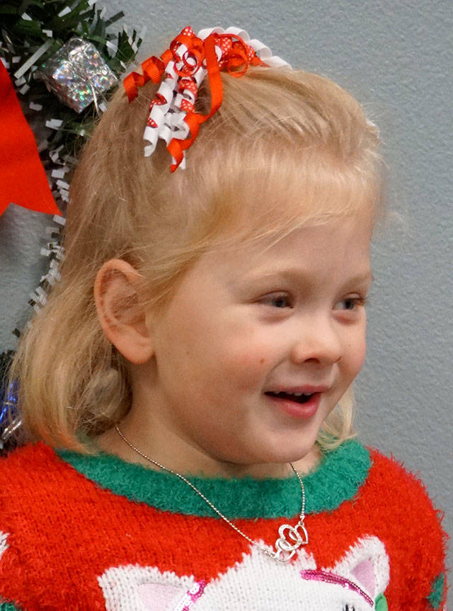 I like helping my mom wrap presents.                                 Raegan Hunt, 4