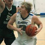Greg Brehmer (50) tries to get by Liam Clark of Port Angeles in an 83-52 loss on Dec. 18. (Mark Krulish/Kitsap News Group)