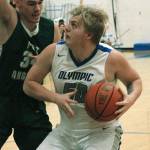 Greg Brehmer (50) tries to get by Liam Clark of Port Angeles in an 83-52 loss on Dec. 18. (Mark Krulish/Kitsap News Group)