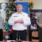 South Kitsap Fire and Rescue assistant fire chief Jeff Faucett speaks to a packed news media briefing Wednesday morning at Walmarts Bethel Avenue store, which is doubling as a command center for disaster-response teams. (Bob Smith | Kitsap Daily News)