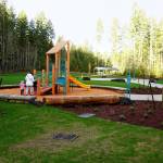 Some residents got a quick preview of the new McCormick Village Park prior to its official ribbon-cutting ceremony Dec. 21. (Bob Smith | Kitsap Daily News)