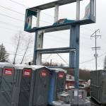 The Bethel Square shopping center sign damaged by the recent tornado awaits repairs. (Bob Smith | Kitsap Daily News)