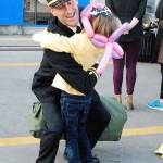 This Nimitz daddy gives a hug to one of his tearful daughters.
