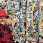 Elda Armstrong showcases her gallery. Each visitor that purchases a Christmas tree from St. Micks has their photo taken and placed on a wall for display next year. Nick Twietmeyer / Kitsap News Group
