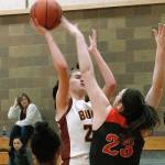 Kingston freshman Ellee Brockman tries to put a shot over Central Kitsaps Alexandra Neumann. (Mark Krulish/Kitsap News Group)