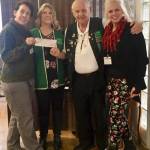 The Port Orchard Eagles organization hands over a check donation of $3,500 to South Kitsap Helpline for its Christmas holiday food and gift-giving program. From left to right: Jeannette Murphy of South Kitsap Helpline; Kelli Walker and Larry Tibbets of the Eagles; and Jennifer Hardison, executive director of South Kitsap Helpline. (Courtesy photo)