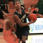 North Kitsap guard Kobe McMillian drives the lane in his teams 62-34 win over Bremerton. (Mark Krulish/Kitsap News Group)