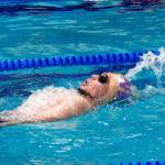 Yordan Henry of North Kitsap swims the 100-yard backstroke. (Mark Krulish/Kitsap News Group)