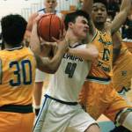 <em>Brandon Barron (4) attempts to slice between two Bremerton defenders during a Jan. 15 matchup</em> Mark Krulish/Kitsap News Group