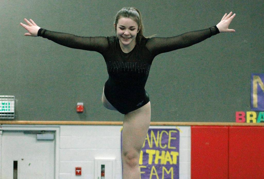 Angelina Golden keeps herself steady on the balance beam. (Mark Krulish/Kitsap News Group)