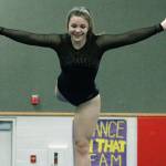 Angelina Golden keeps herself steady on the balance beam. (Mark Krulish/Kitsap News Group)