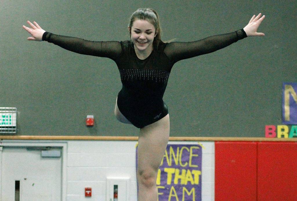 Angelina Golden keeps herself steady on the balance beam. (Mark Krulish/Kitsap News Group)