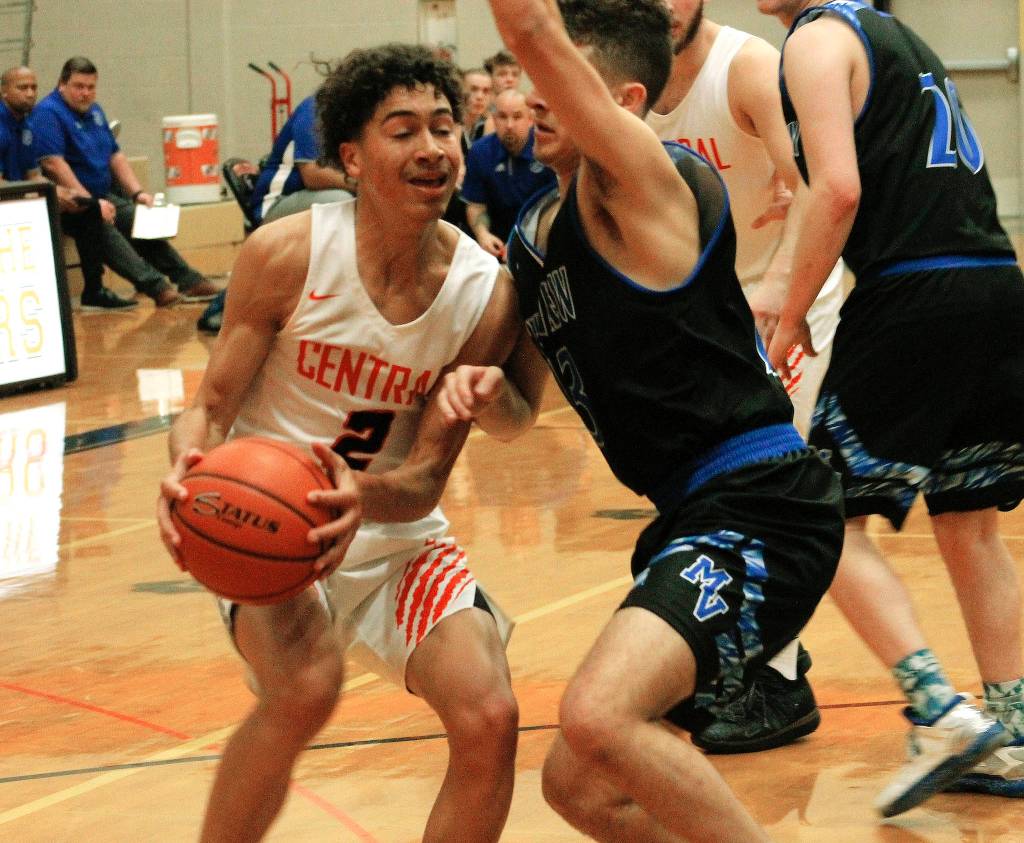 Owen Davies drives to the basket against Mountain View. The Cougars comeback effort fell short in an 80-77 loss. (Mark Krulish/Kitsap News Group)
