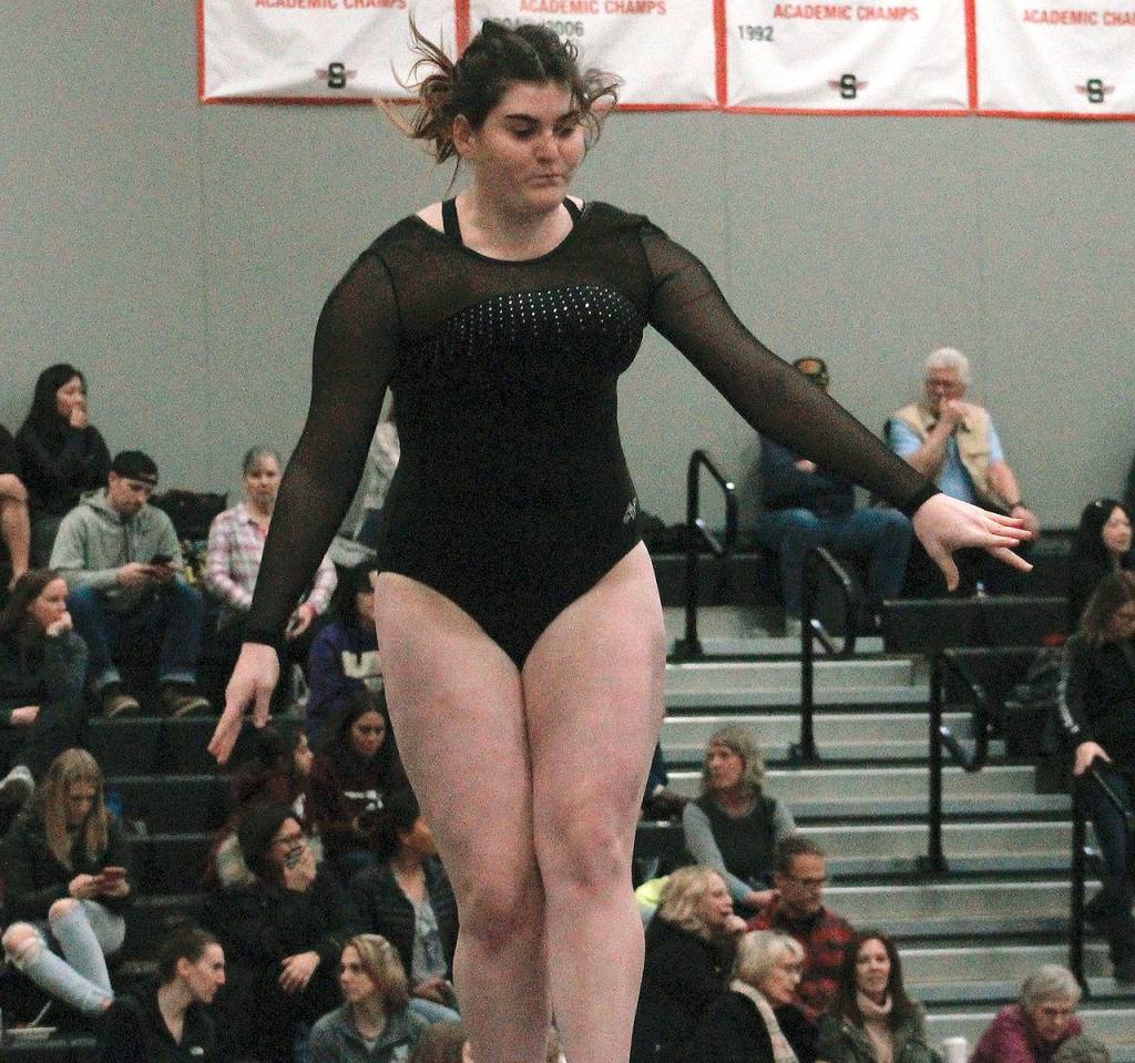 Caytlin Johnson of North Kitsap leaps off the balance beam at the state meet. (Mark Krulish/Kitsap News Group)