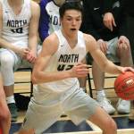 Jamo Moore looks for an opening in the paint during his teams 59-51 win over Clarkston. (Mark Krulish/Kitsap News Group)