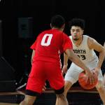 North Kitsap forward Shaa Humphrey guards Rentons OShae Barquet (0) during the first round of the state tournament. (Mark Krulish/Kitsap News Group)