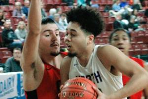 North Kitsaps Shaa Humphrey drives to the hoop against Clarkston in the fourth place game at the state tournament. The Vikings lost, 50-32. (Mark Krulish/Kitsap News Group)