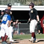 Sam Canton comes to the plate to celebrate after hitting a leadoff home run against Graham-Kapowsin. (Mark Krulish/Kitsap News Group)