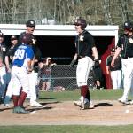 Sam Canton comes to the plate to celebrate after hitting a leadoff home run against Graham-Kapowsin. (Mark Krulish/Kitsap News Group)