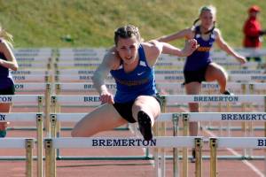 State champion hurdler Lauryn Chandler leaps to victory in the 100-meter hurdles. (Mark Krulish/Kitsap News Group)