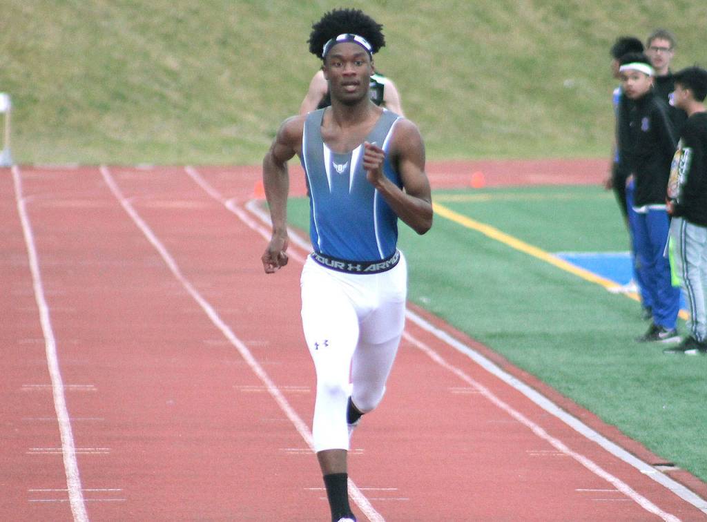 Olympics Adam Johnson sprints to the finish line in the 200-meter run. (Mark Krulish/Kitsap News Group)