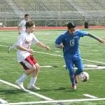 Maynor Sutuj (18) and Kaeden Schaefer go for a loose ball. (Mark Krulish/Kitsap News Group)