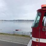 On-duty rescue swimmers search inside and surrounding a submerged vehicle March 24 in the waters off Beach Drive and Olney Avenue. No one was found who might have been identified as the driver or occupants. (SKFR photo)