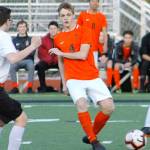 Central Kitsap senior Carter Nilsen slips a pass through the Yelm defense. (Mark Krulish/Kitsap News Group)
