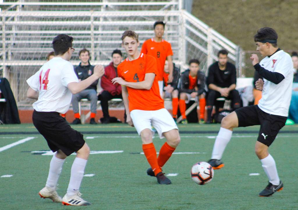 Central Kitsap senior Carter Nilsen slips a pass through the Yelm defense. (Mark Krulish/Kitsap News Group)