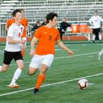 Josh Roche looks for a passing option against Yelm. (Mark Krulish/Kitsap News Group)