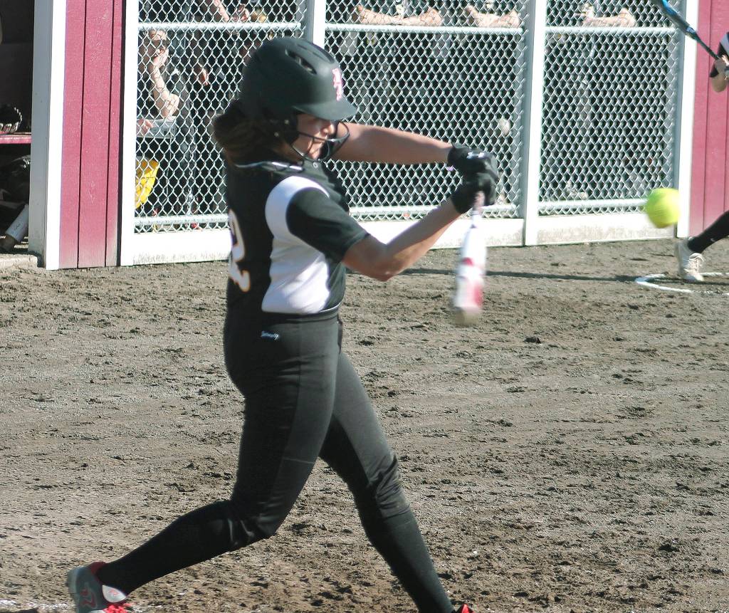 Mark Krulish | Kitsap News Group                                Sarah Hoyt connects for a base hit against Puyallup.