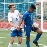 Evan Frankowski (4) and Jesus Gonzalez battle for a loose ball. (Mark Krulish/Kitsap News Group)