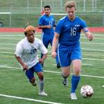 Olympics Ryan Geier (16) is pursued by Bremertons Raul Islas-Barojas. (Mark Krulish/Kitsap News Group)