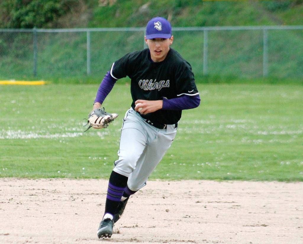 Dalton Brockett breaks for first base to make an out. (Mark Krulish/Kitsap News Group)