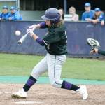 Josh Fisher drives a ball the opposite way in North Kitsaps win over North Mason. (Mark Krulish/Kitsap News Group)