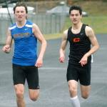 Bremertons Erik Anderson and Central Kitsaps Louis Gannon run side-by-side during the 800. (Mark Krulish/Kitsap News Group)
