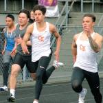 Central Kitsaps Jason Almonte (left) and Alex Refilong race in the 100-meter dash. (Mark Krulish/Kitsap News Group)