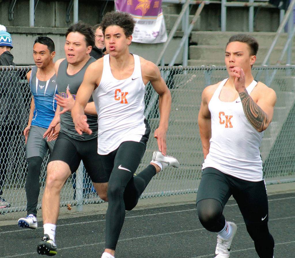 Central Kitsaps Jason Almonte (left) and Alex Refilong race in the 100-meter dash. (Mark Krulish/Kitsap News Group)