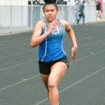 Olympic sprinter Victory Thomas races for the finish line in the 100-meter dash. (Mark Krulish/Kitsap News Group)