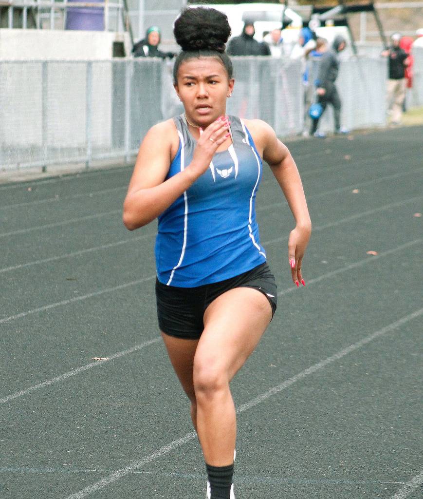Olympic sprinter Victory Thomas races for the finish line in the 100-meter dash. (Mark Krulish/Kitsap News Group)
