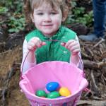 Annabelle Adams, 4, shows off the bounty of her Easter egg hunt Saturday at South Kitsap Regional Park. (Bob Smith | Kitsap Daily News)