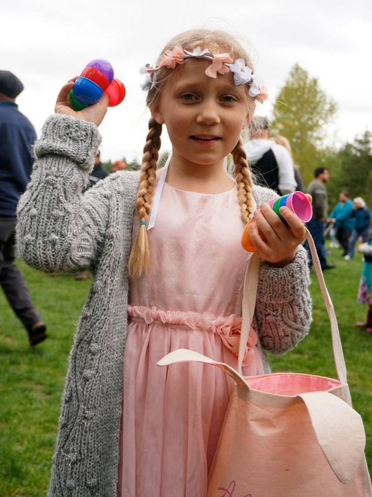 Alison Otto, 8, filled her basket at the Fathoms O Fun Easter Egg Hunt April 20 at South Kitsap Regional Park. (Bob Smith | Kitsap Daily News)