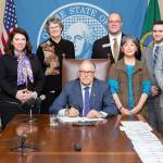 Rep. Michelle Caldier, R-Port Orchard (second from left) joined others as Gov. Jay Inslee signs House Bill 1198. The measure will require health providers sanctioned for sexual misconduct to notify patients of the sanction details. (Washington State House Republicans)