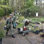 Cadets from Washington Youth Academy help load trailers with plants for the weekend plant sale at Manchester Library. (Friends of Manchester Library photo)