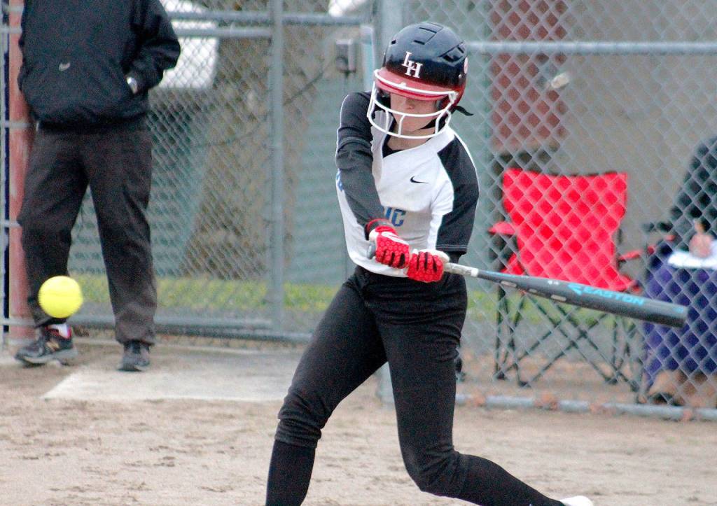 Olympic junior Molly Gates drives a ball against North Kitsap. (Mark Krulish/Kitsap News Group)