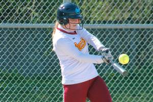Keira Alvarez connects for a base hit against Klahowya. (Mark Krulish/Kitsap News Group)