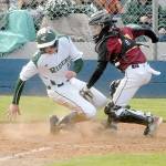 Port Angeles Ethan Flodstrom, left, attempts to steal home as Kingston catcher Tyler Bates, cuts him off for an out during the third inning on Wednesday at Port Angeles Civic Field. (Keith Thorpe/Peninsula Daily News)