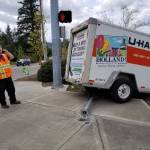 Freewheeling U-Haul trailer, comes loose from hitch, smashes into crosswalk pole in Poulsbo