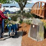 Civic volunteers, including Port Orchard Council member Cindy Lucarelli, cleaned up Etta Turner Park near the waterfront. (Bob Smith | Kitsap Daily News)